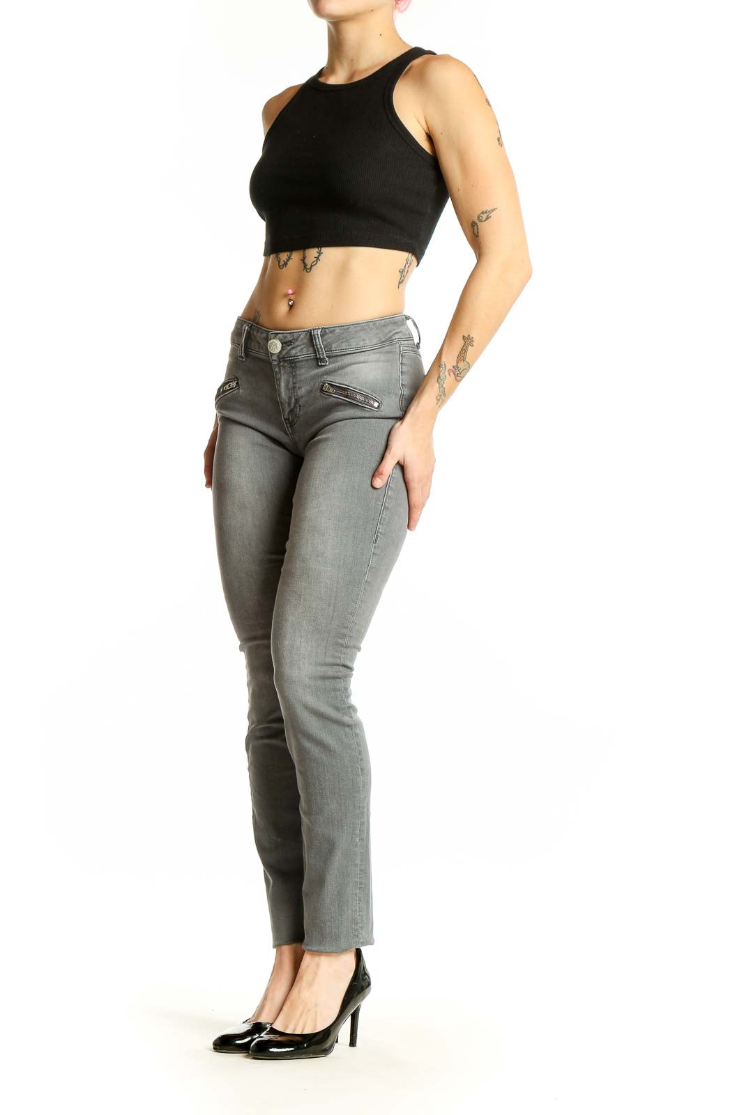 Front view of Cabi gray skinny jeans with zipper pocket details