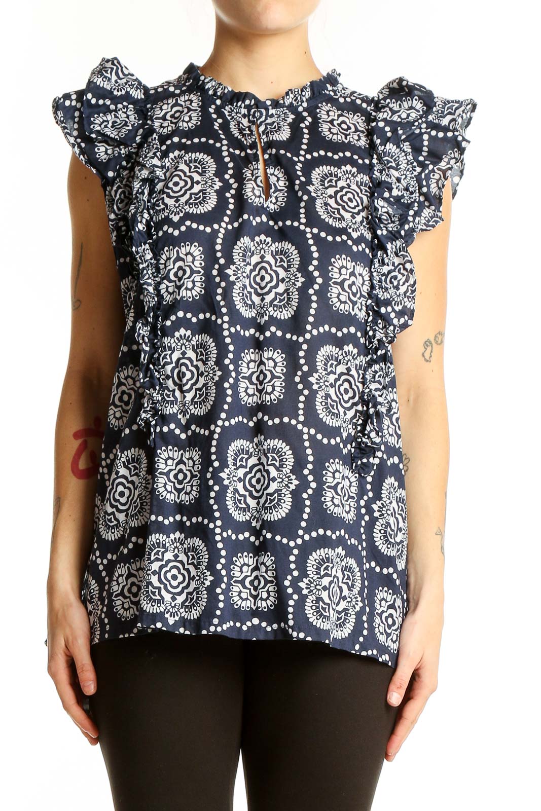 Front view of Ann Taylor navy blouse with white floral print and ruffle sleeves