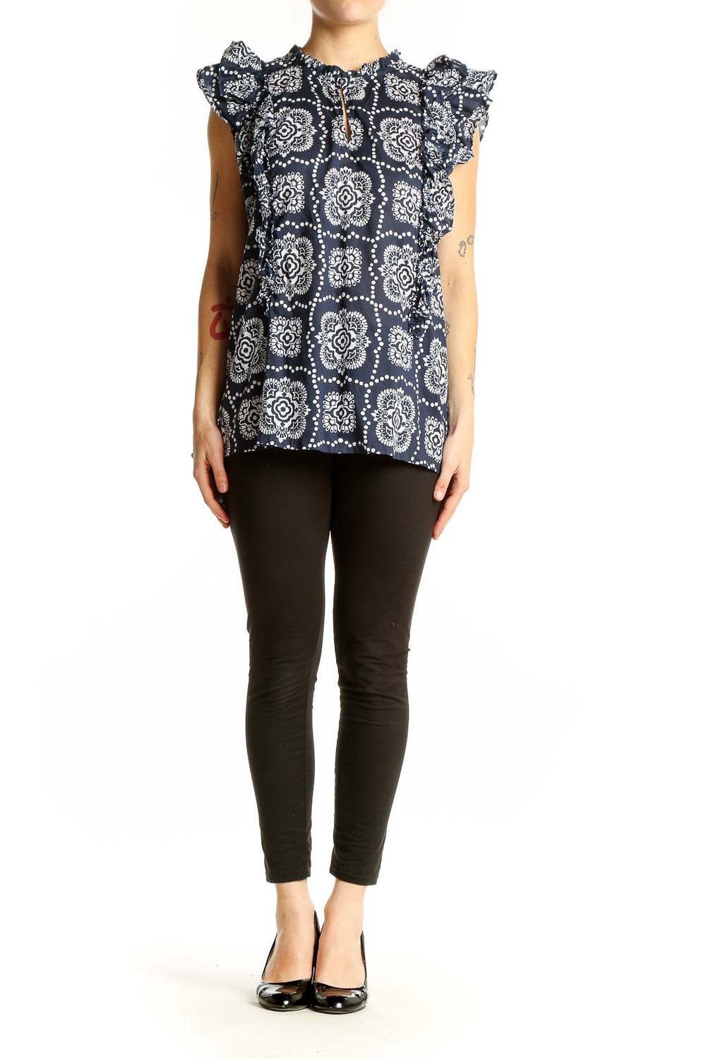 Front view of Ann Taylor navy blouse with white floral print and ruffle sleeves