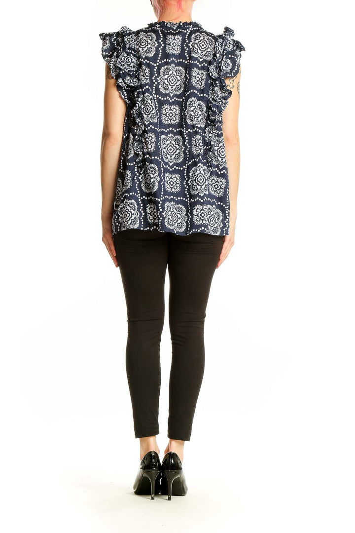 Back view of Ann Taylor navy floral print blouse showing ruffle sleeve detail