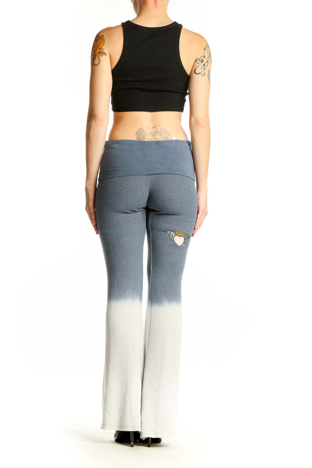 Side view of model wearing BOYSLIE gray ombre flared yoga pants