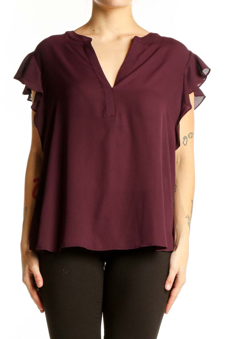 Front view of burgundy Calvin Klein blouse with ruffled sleeves and V-neck