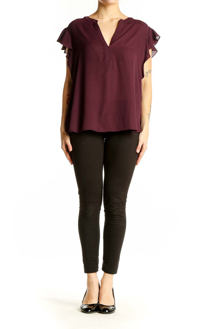 Front view of burgundy Calvin Klein blouse with ruffled sleeves and V-neck