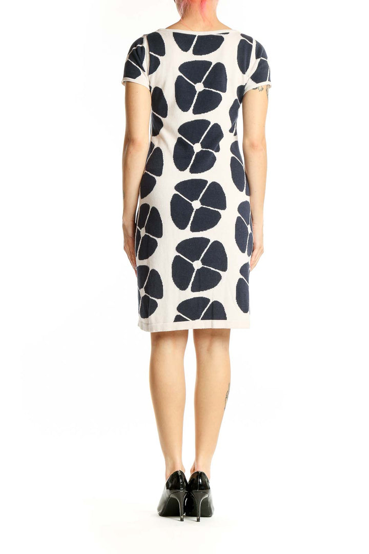 Side view of Boden navy and white floral print knit dress