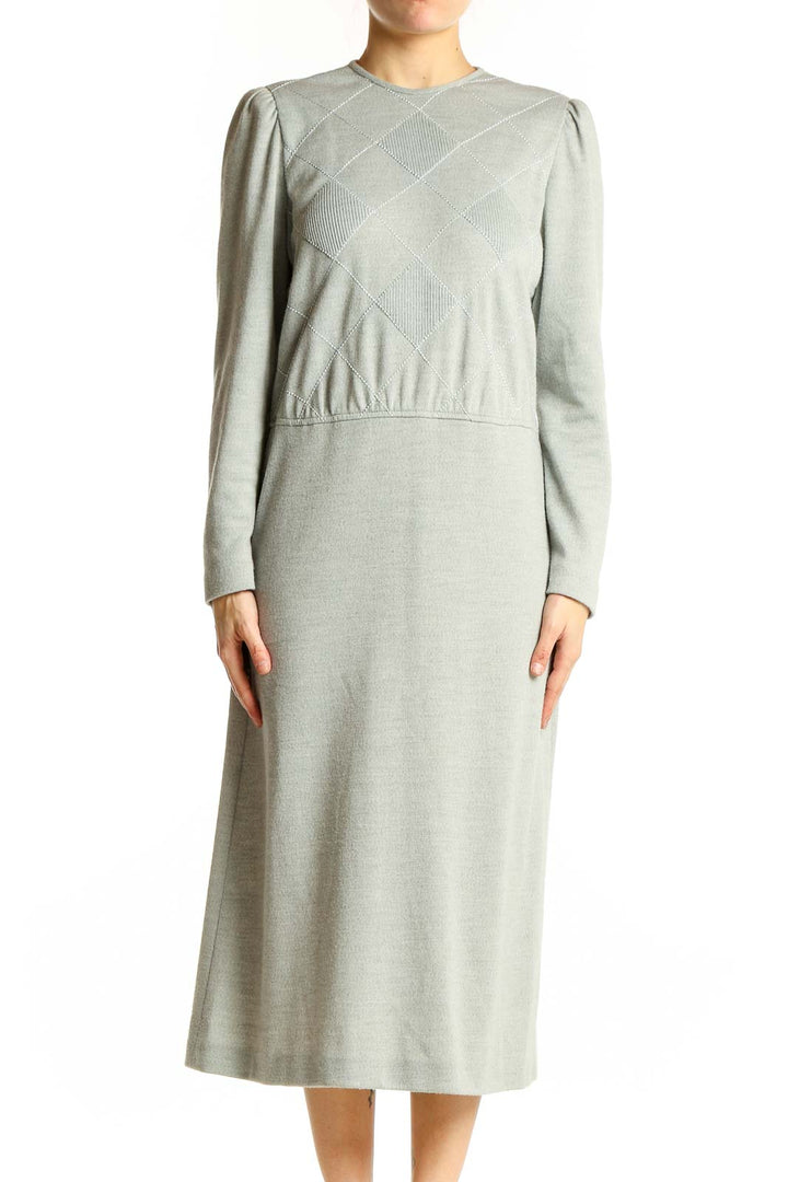 Front view of sage green Leslie Fay midi dress with diamond-patterned bodice and long sleeves