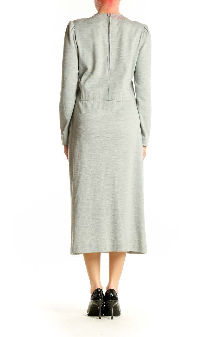 Back view of sage green Leslie Fay midi dress showing fit-and-flare silhouette