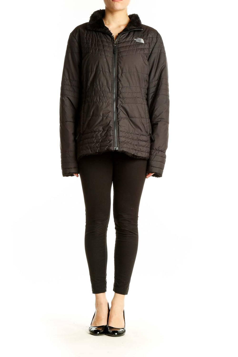 Front view of black quilted The North Face jacket with sherpa-lined collar