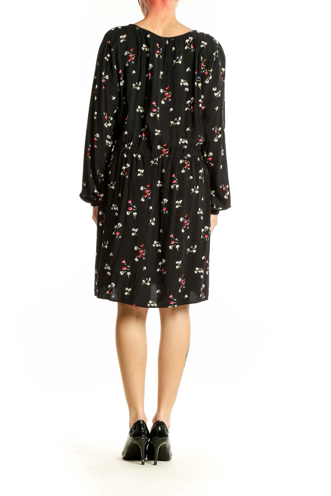 Side view of LOFT black rayon dress showing floral print and long sleeves