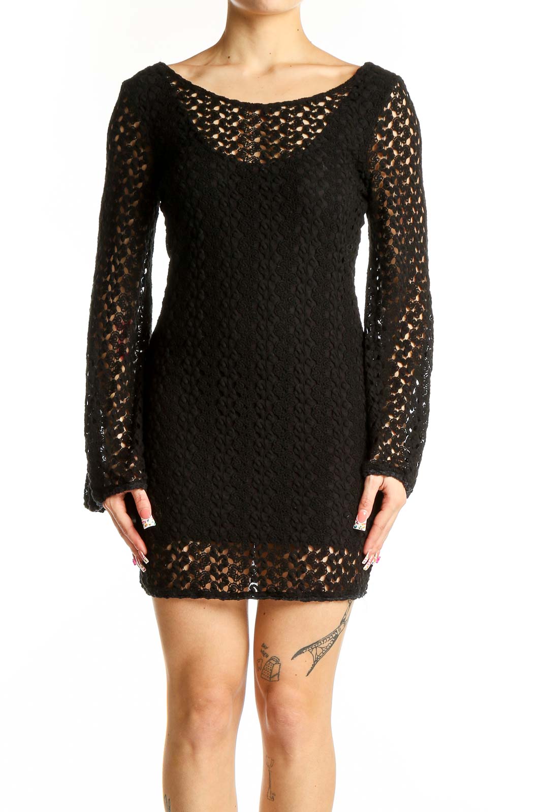 Front view of Free People black crochet knit mini dress with long bell sleeves
