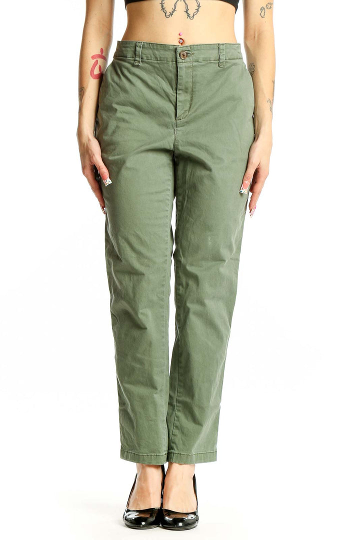 Front view of olive green Gap chino pants on model