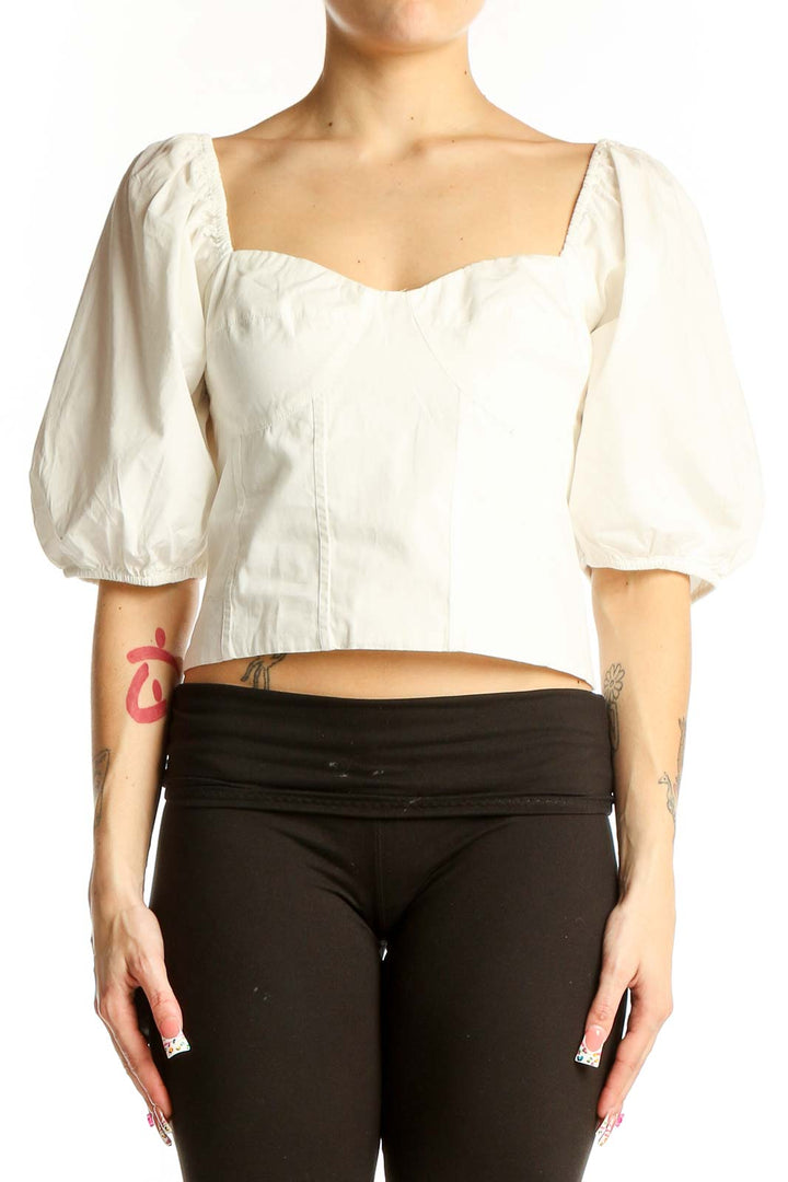 Front view of white cotton puff sleeve crop top from Gap