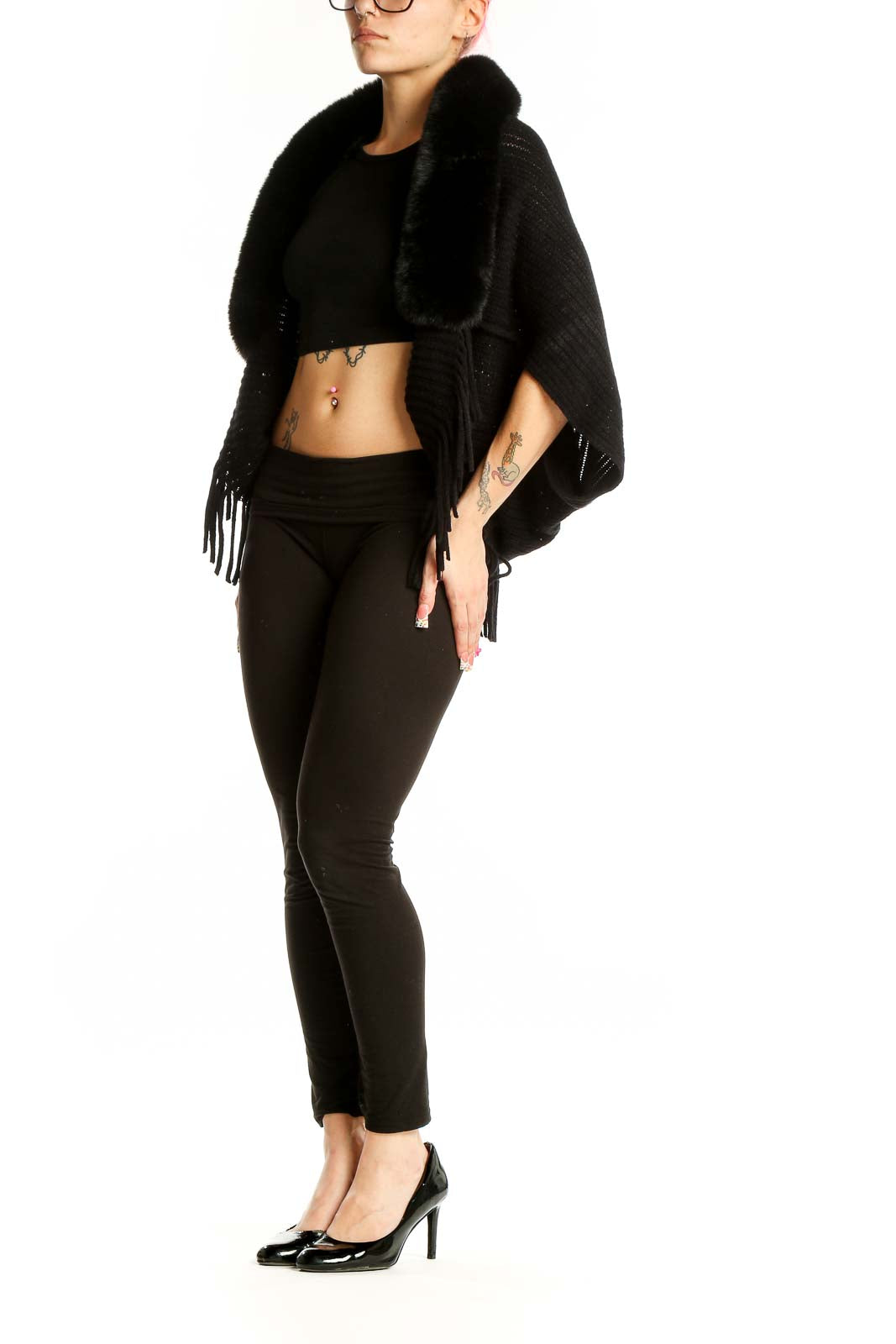 Front view of black knit shawl with fur collar and fringe detail