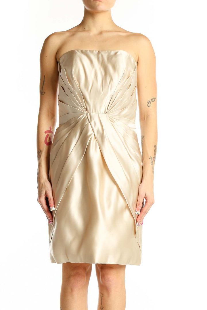 Front view of YSA MAKINO champagne silk strapless cocktail dress with gathered bodice