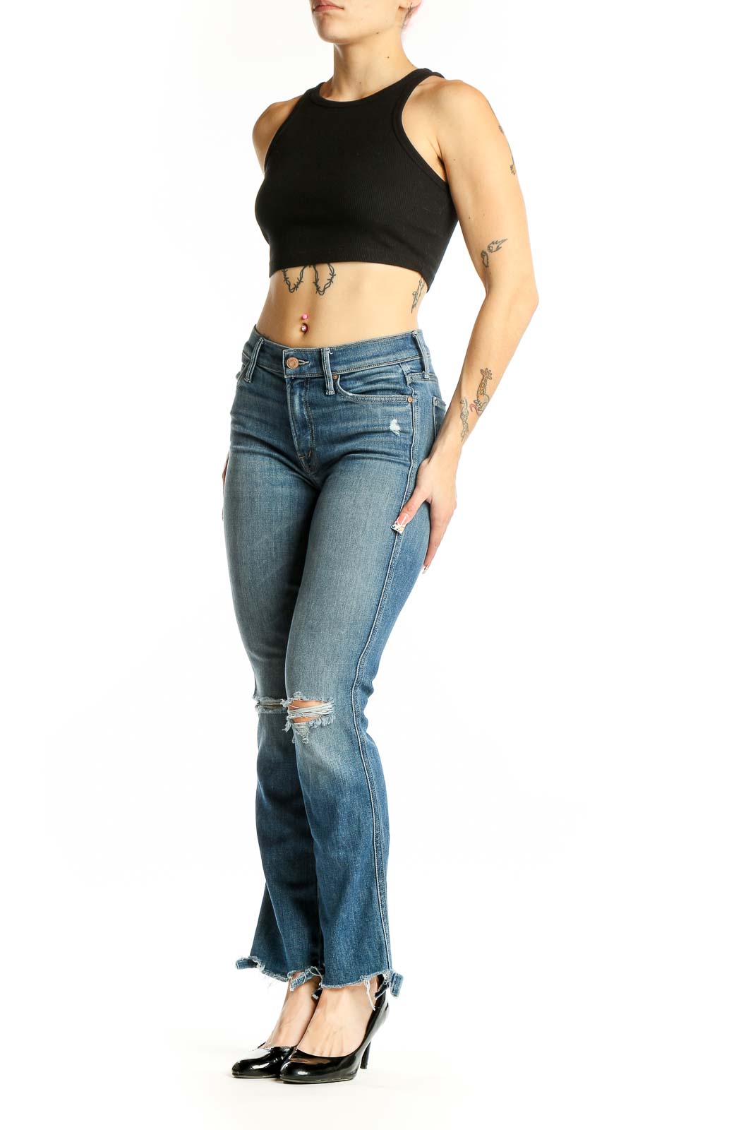 Front view of Mother blue flare jeans with distressed knees