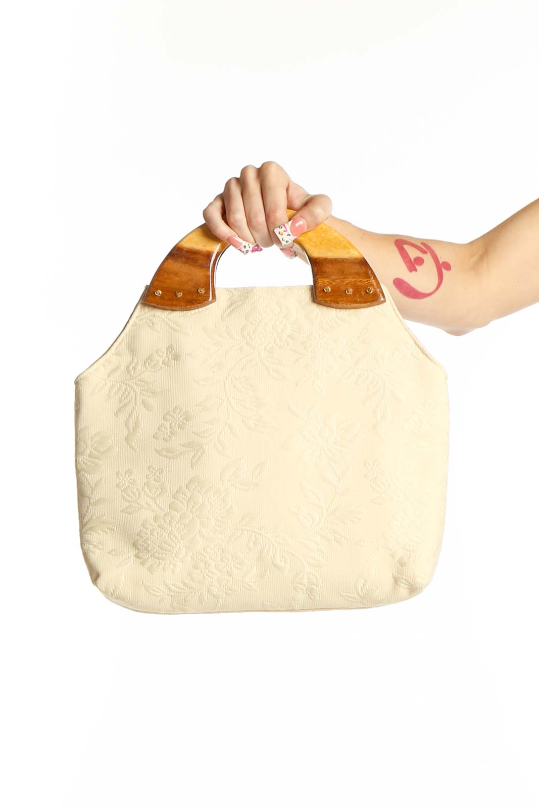 Cream SilkRoll satchel with embossed floral pattern and wooden handles