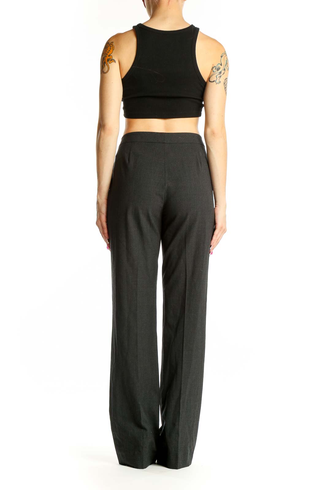 Side view of model wearing charcoal gray wide-leg trousers with black crop top