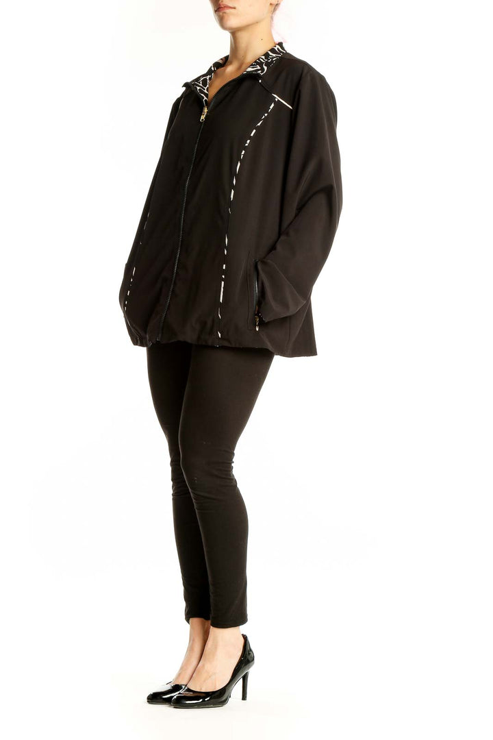 Front view of black SilkRoll athletic jacket with white accents and zip-up design