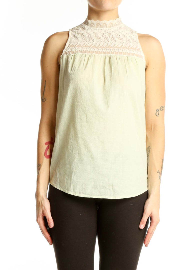 Front view of Zara Trafaluc cream sleeveless top with lace yoke