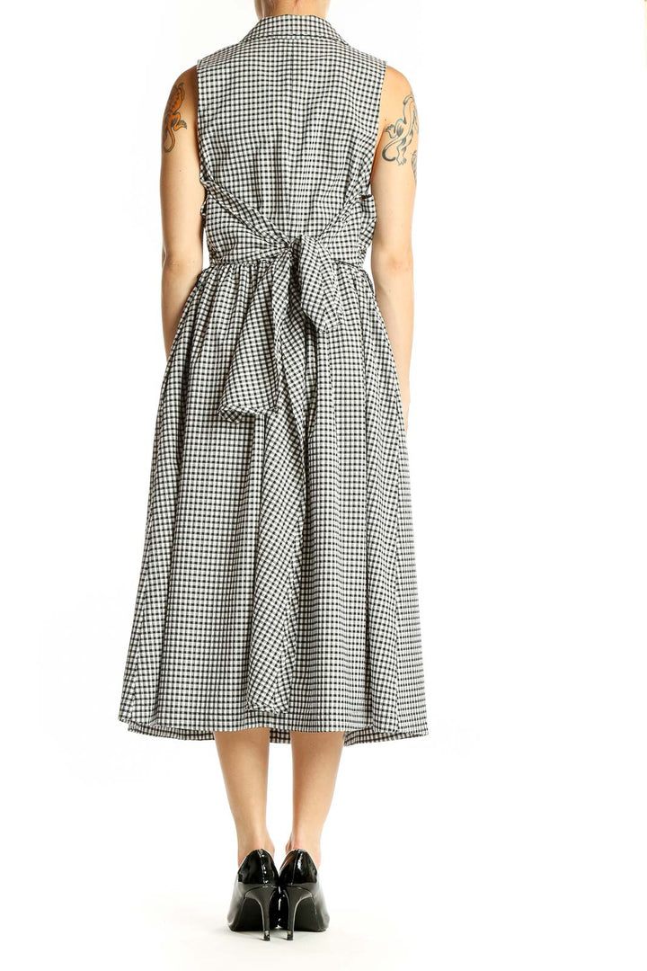 Side view of Donna Karan New York black and white gingham sleeveless midi dress