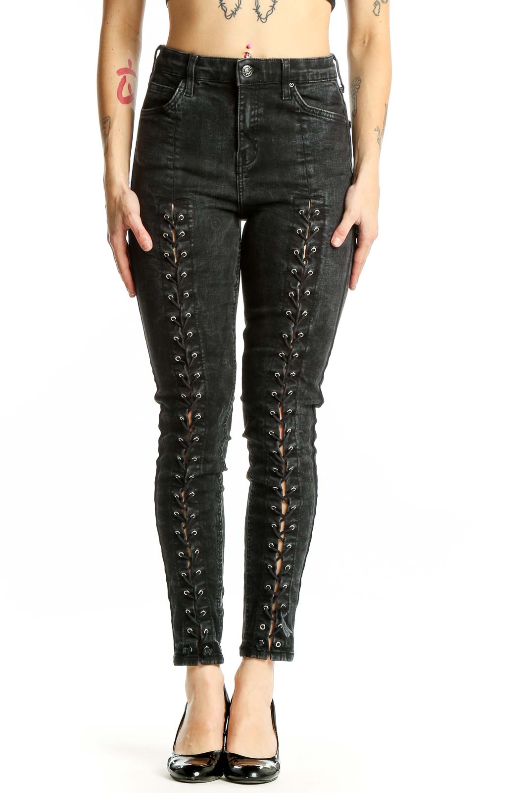 Front view of Topshop black lace-up skinny jeans with edgy details