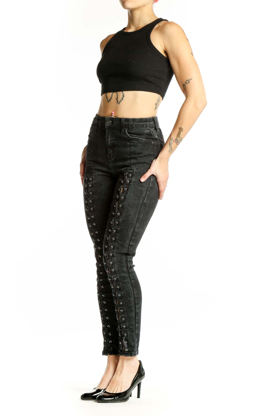 Front view of Topshop black lace-up skinny jeans with edgy details