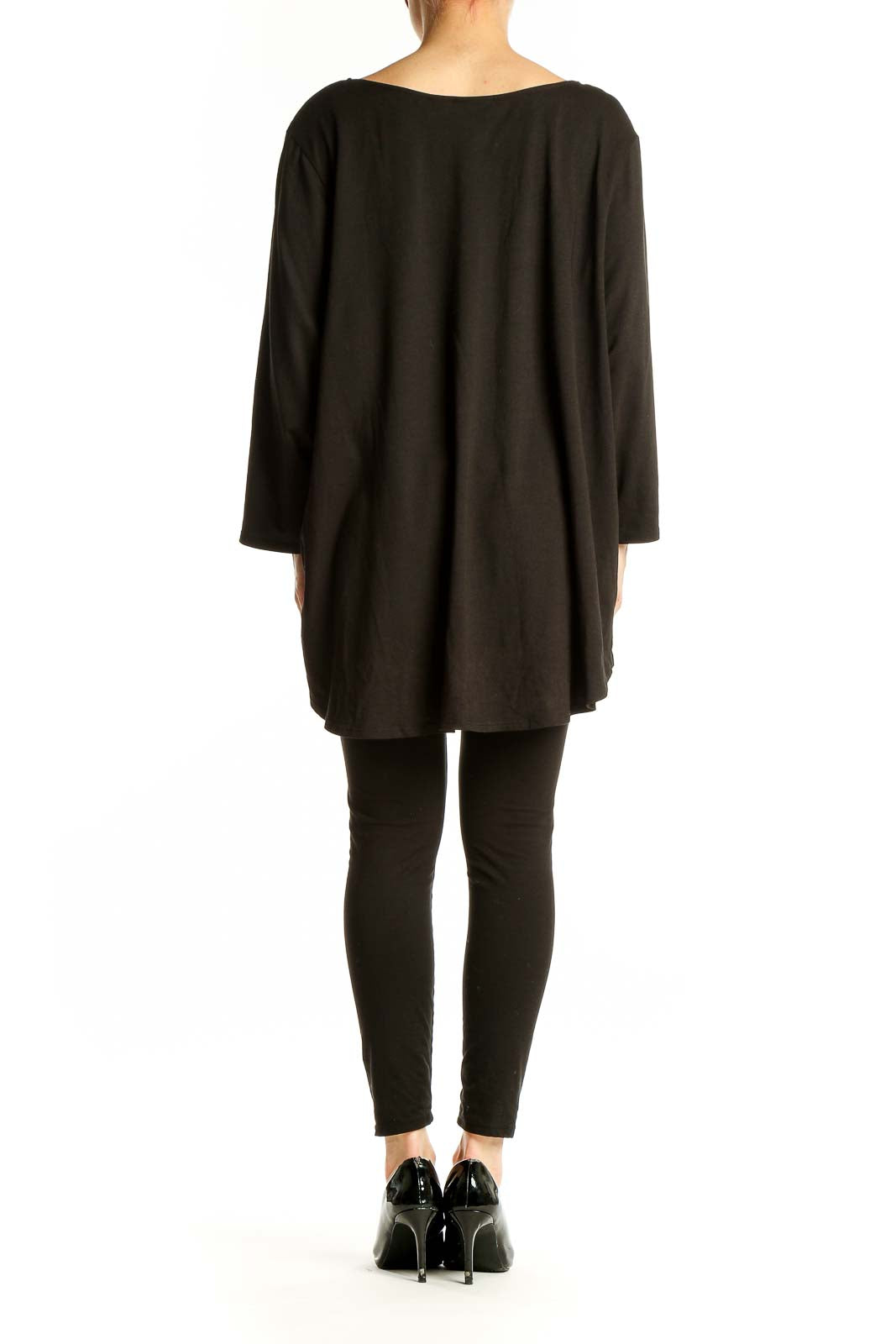 Side view of black Tahari oversized top showing flowy silhouette