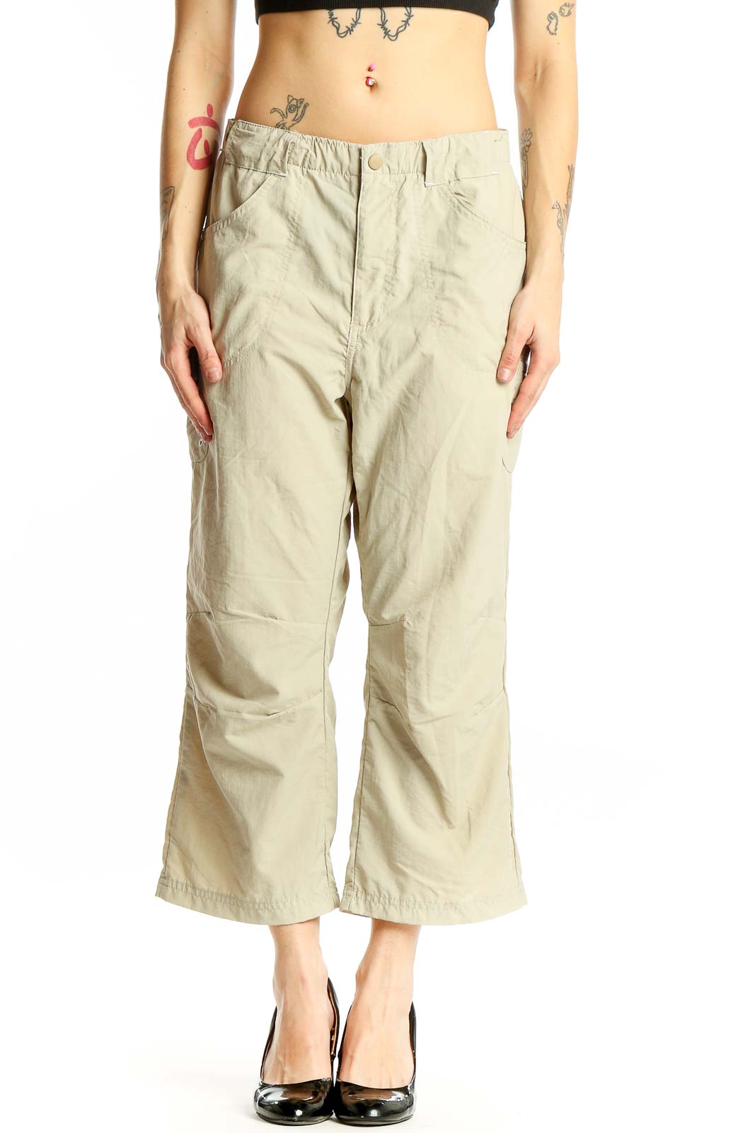 Front view of beige Columbia nylon cropped cargo pants on model