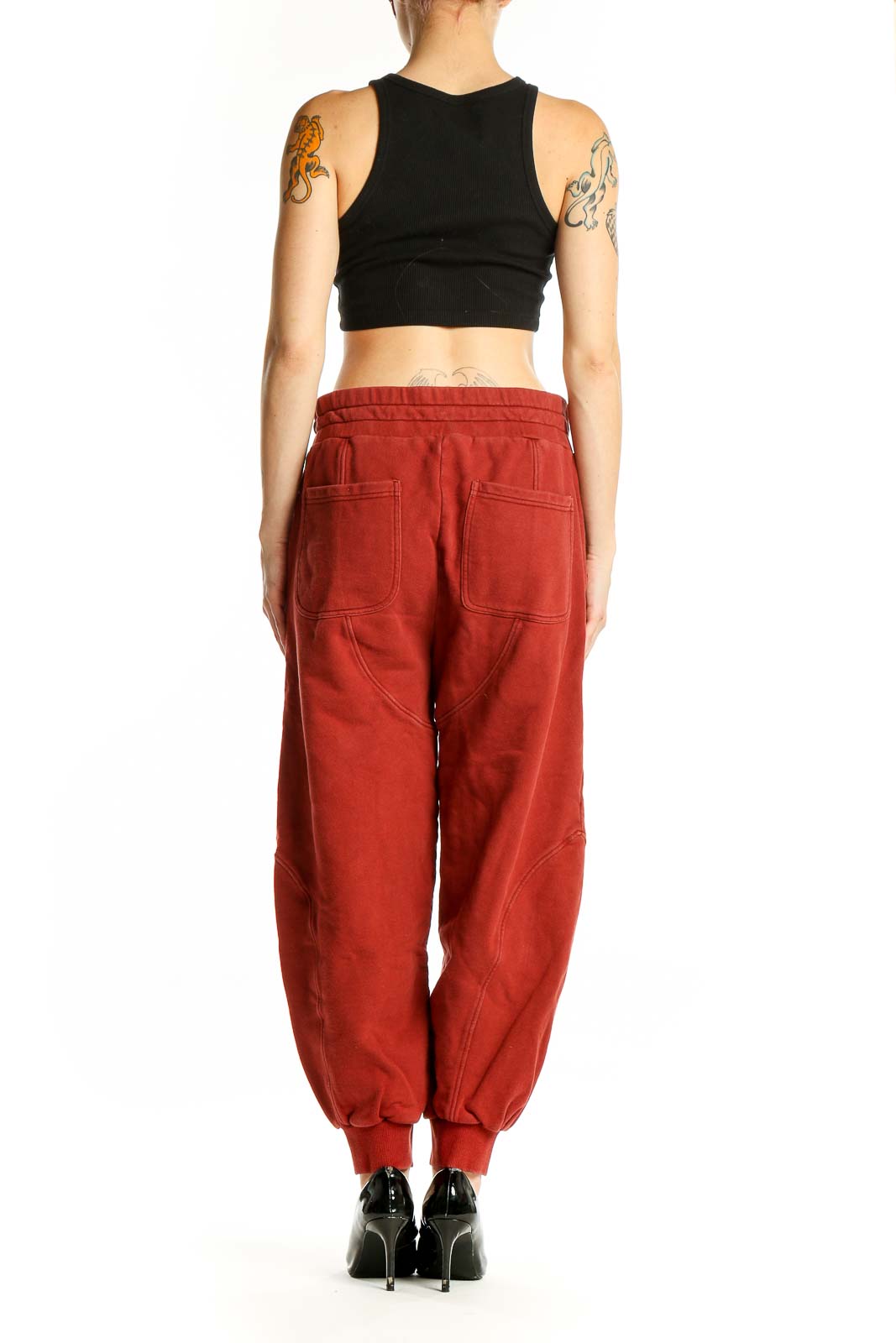 Side view of woman wearing red cotton jogger pants from Soft Joie
