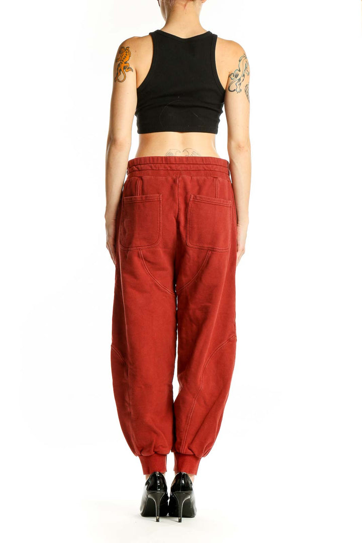 Side view of woman wearing red cotton jogger pants from Soft Joie