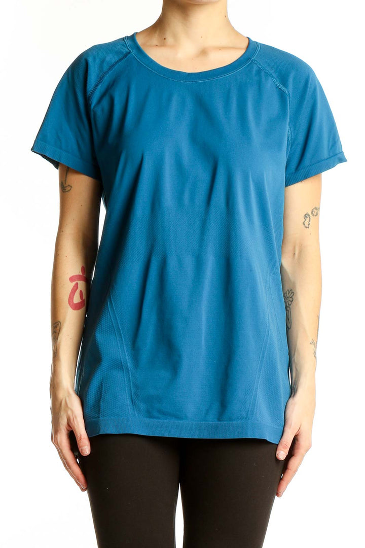 Front view of blue Athleta performance short sleeve top