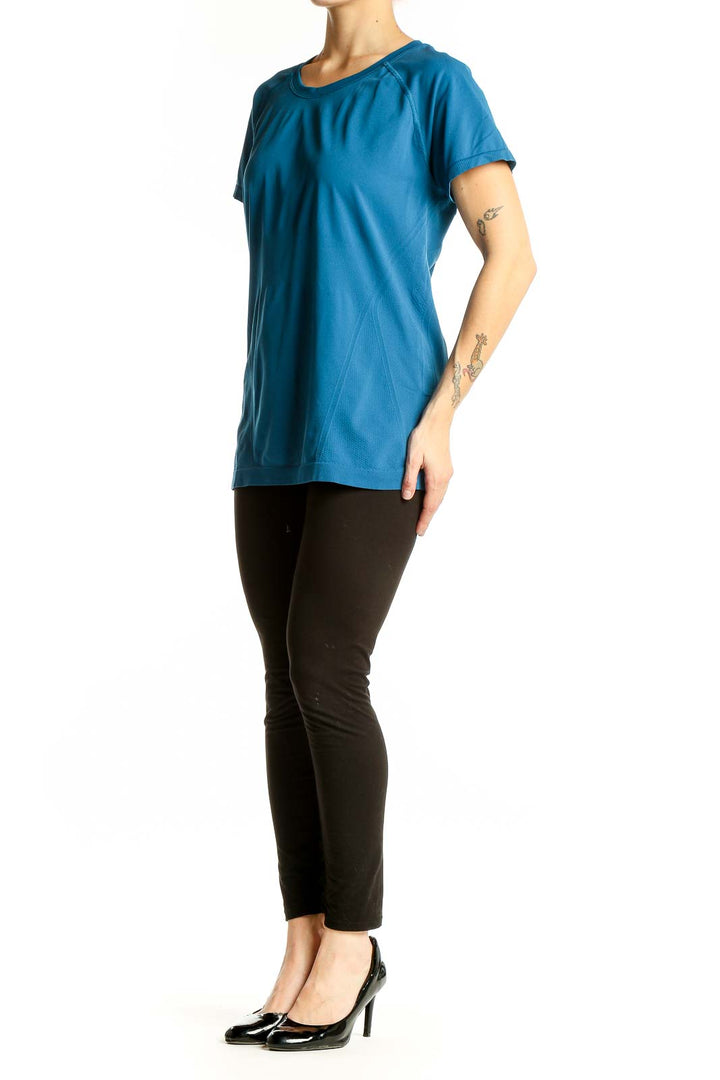 Front view of blue Athleta performance short sleeve top