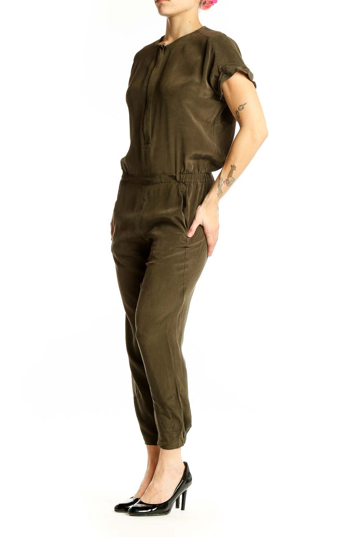 Front view of olive green Vince jumpsuit with half-zip closure