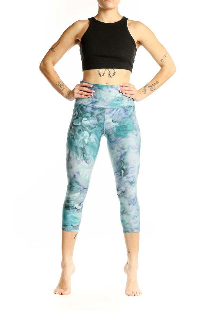 Front view of teal tie-dye capri leggings from Athleta