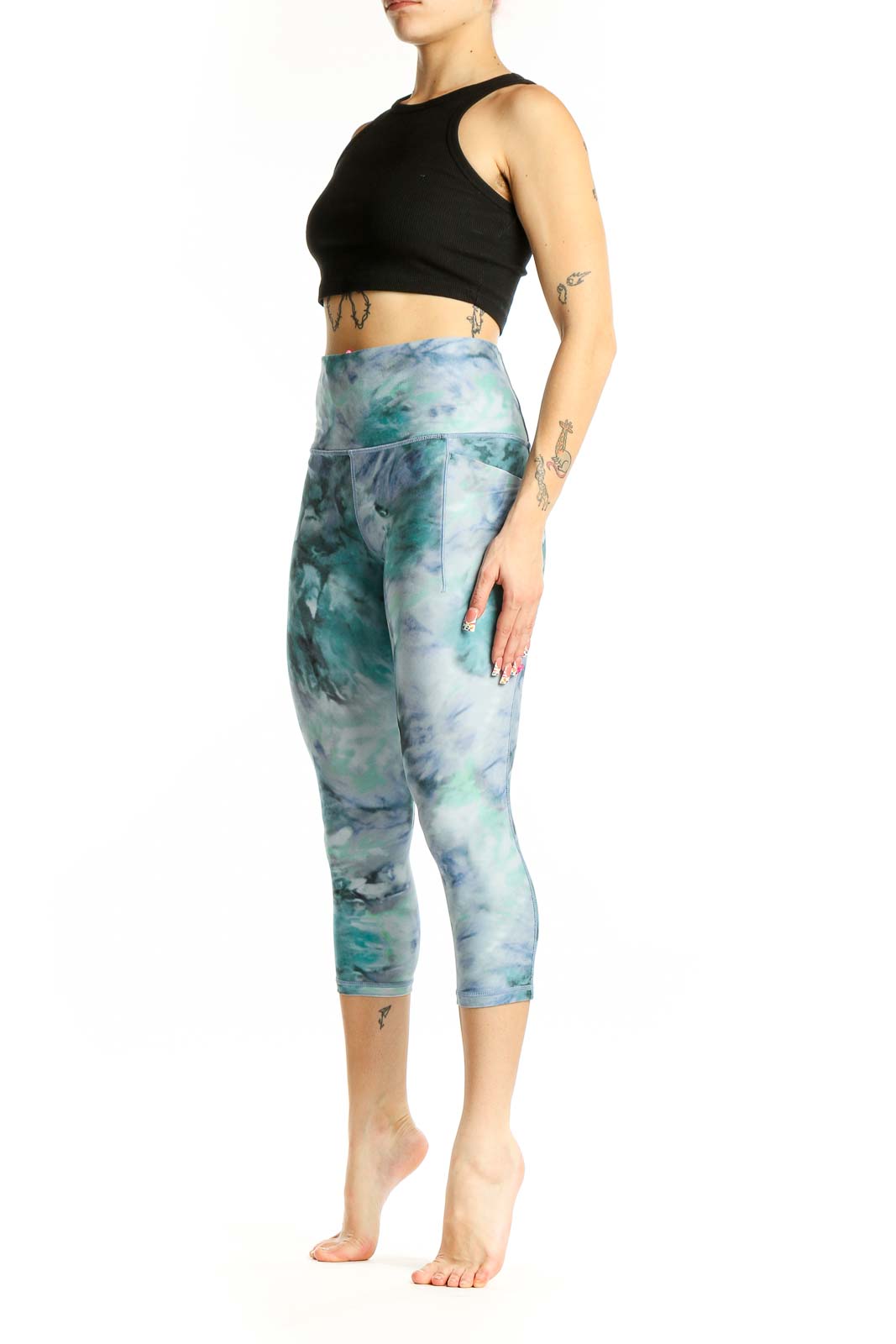 Front view of teal tie-dye capri leggings from Athleta