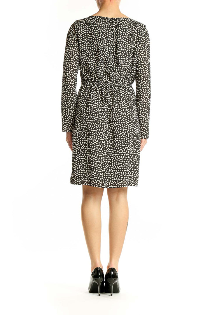 Side view of J.Crew Mercantile black polka dot long sleeve dress