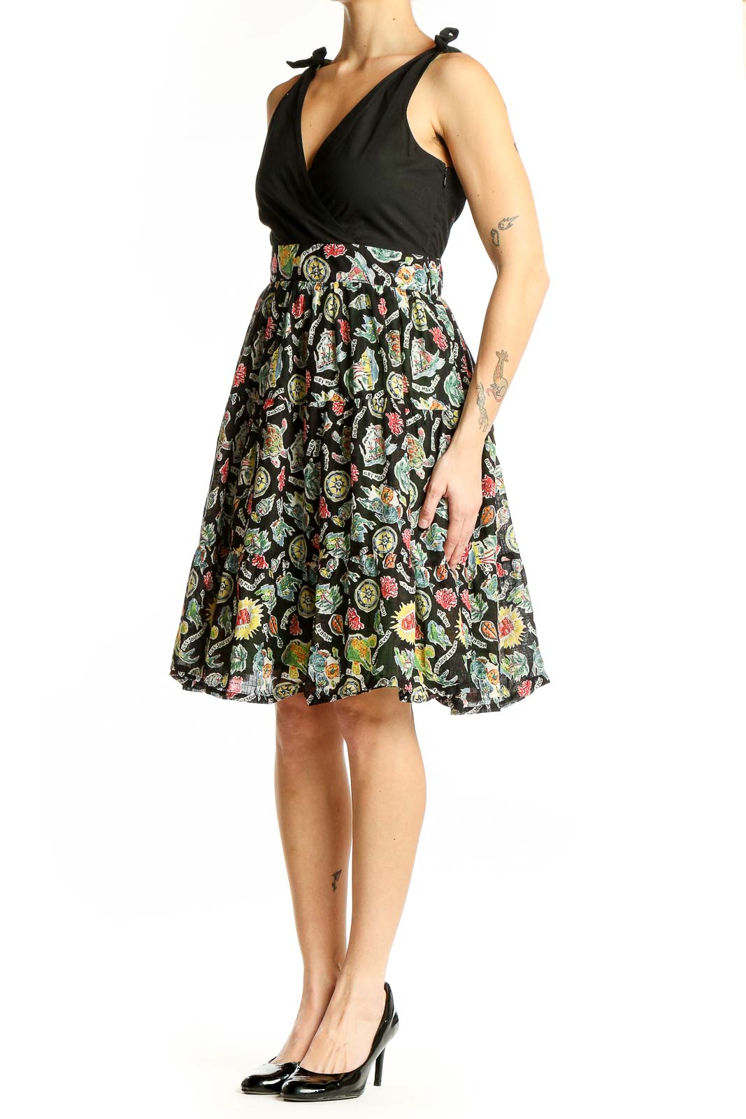 Front view of Maeve Black Floral Wrap Sundress with V-neck and tie shoulders