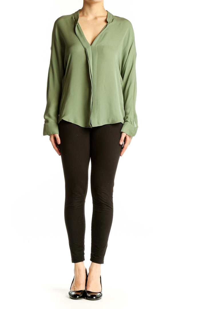 Front view of Vince sage green silk V-neck blouse