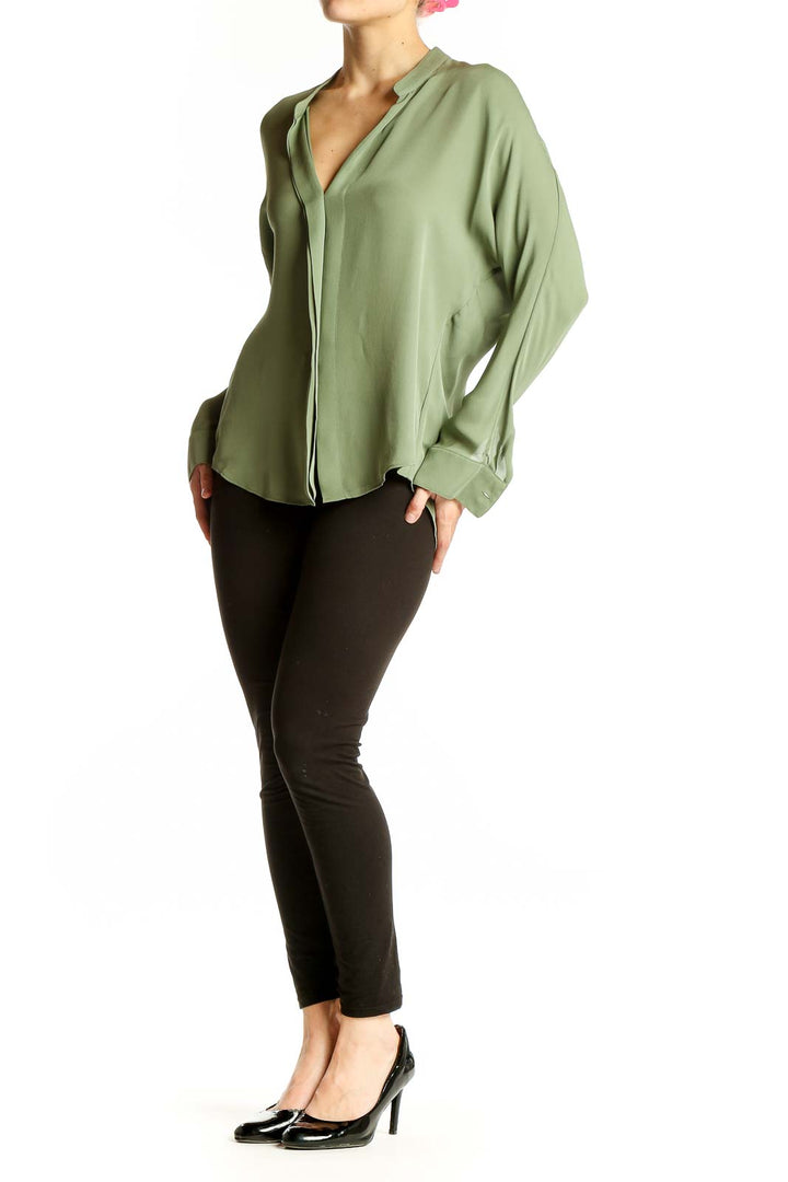 Front view of Vince sage green silk V-neck blouse