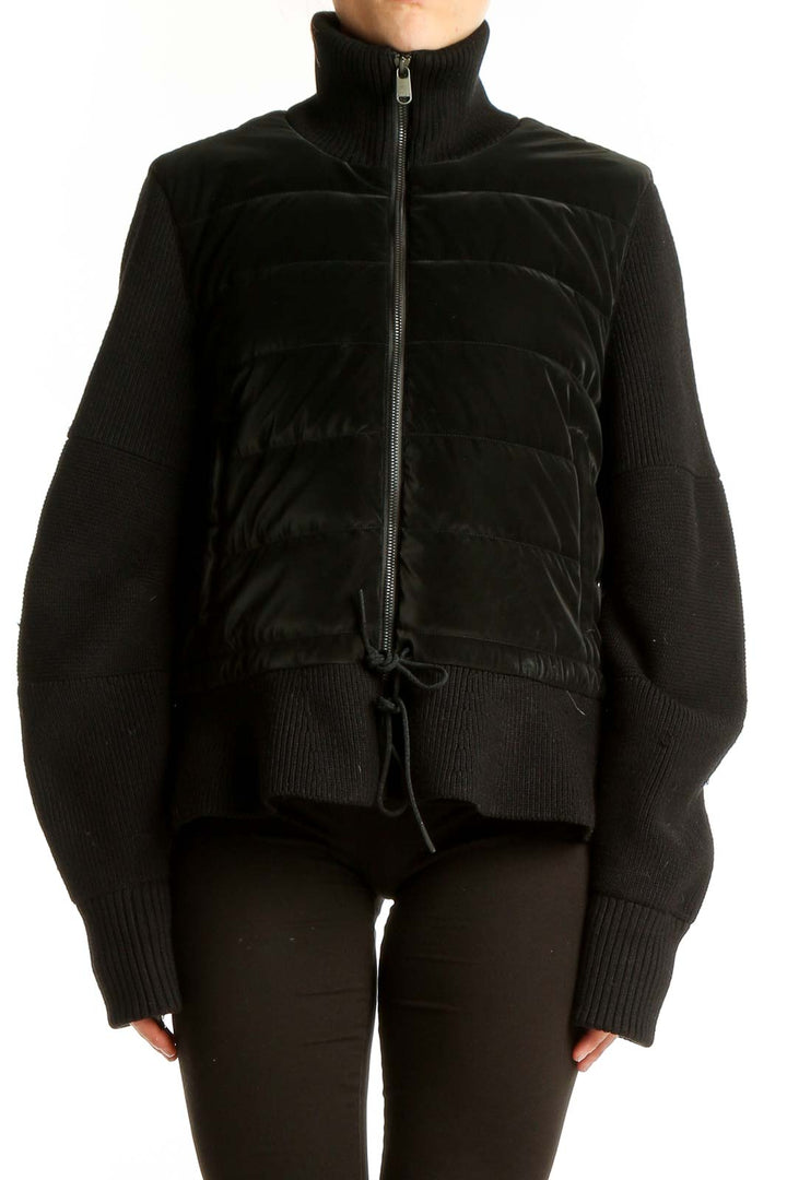 Front view of black quilted Athleta jacket with full-zip and turtleneck