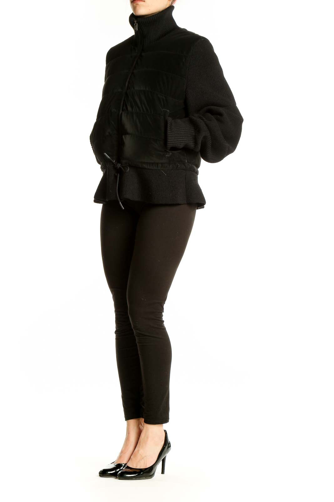 Front view of black quilted Athleta jacket with full-zip and turtleneck