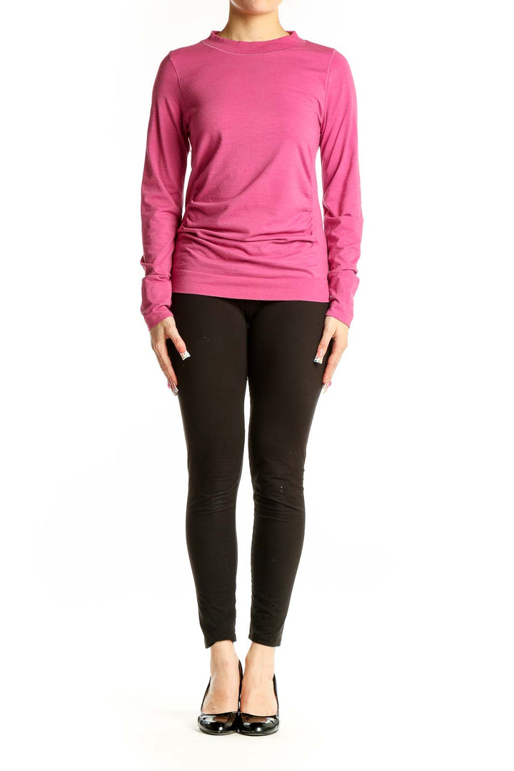 Front view of pink Athleta athletic top with long sleeves