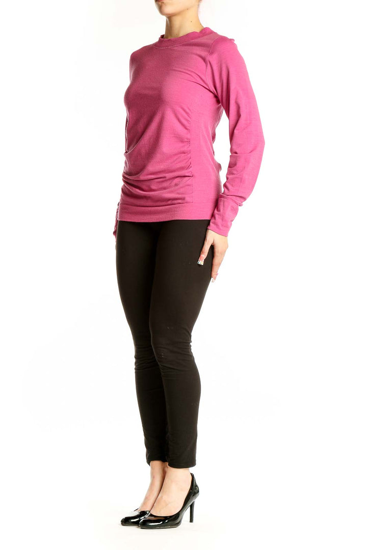 Front view of pink Athleta athletic top with long sleeves
