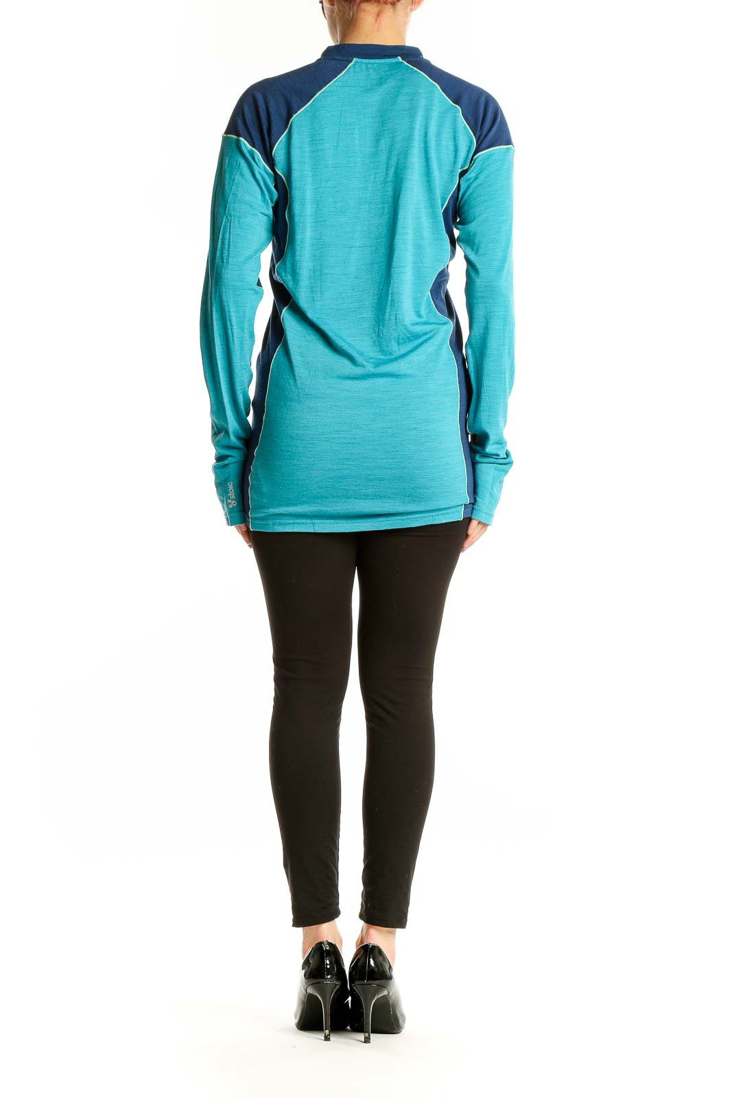 Side view of teal and navy color-block Stoic athletic top on model