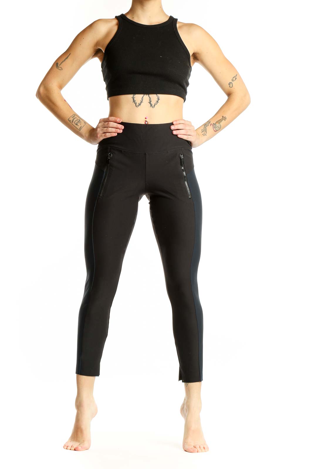 Front view of Athleta black high-waisted leggings with zip pockets