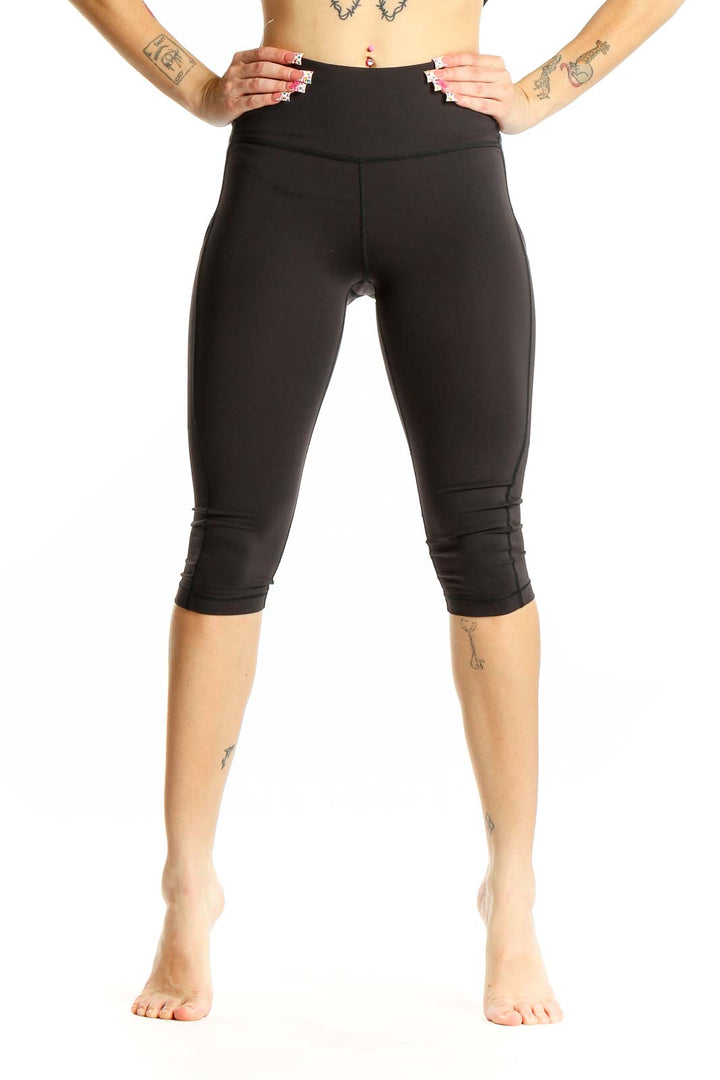 Front view of black Athleta high-waisted capri leggings