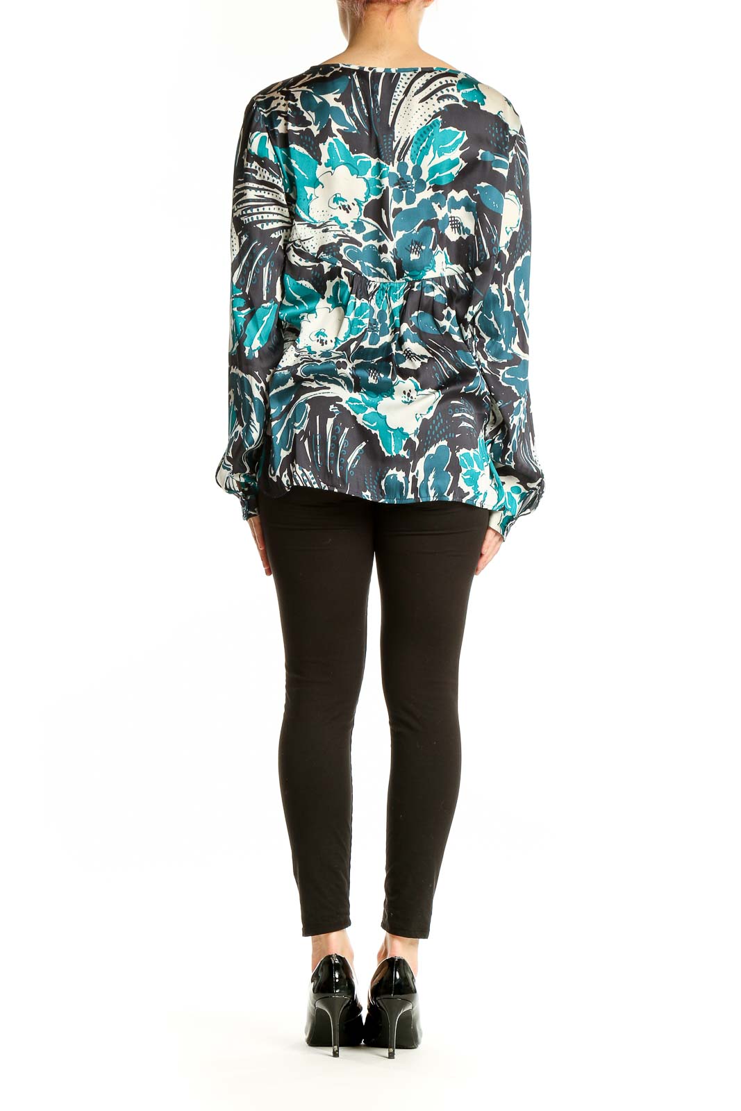 Side view of Sanctuary teal floral print long sleeve blouse on model