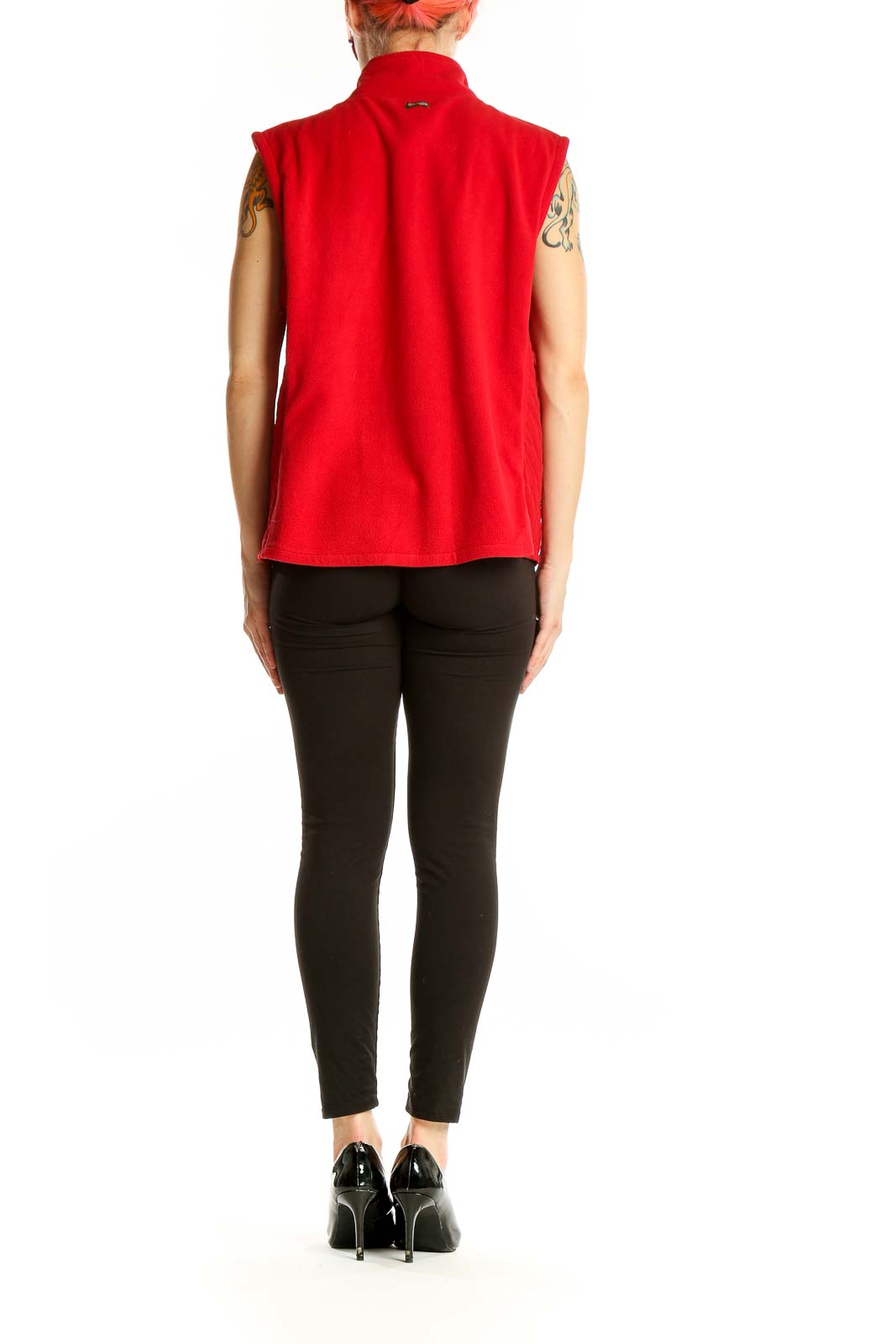 Side view of red Columbia polyester fleece vest on model