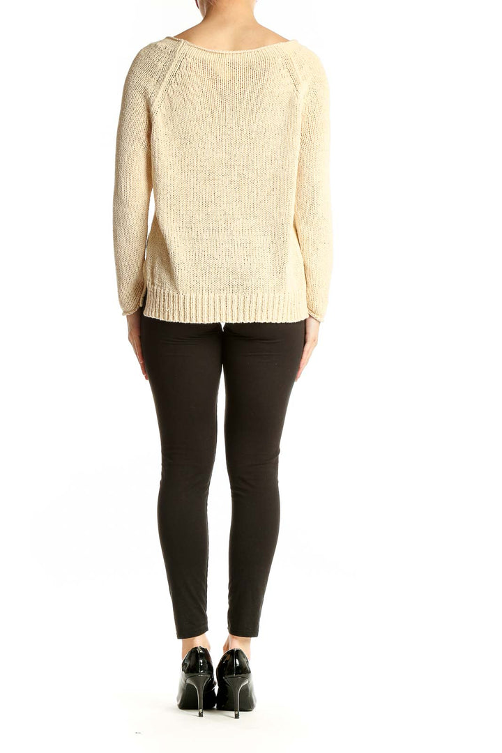 Side view of Vince cream knit sweater showing relaxed fit