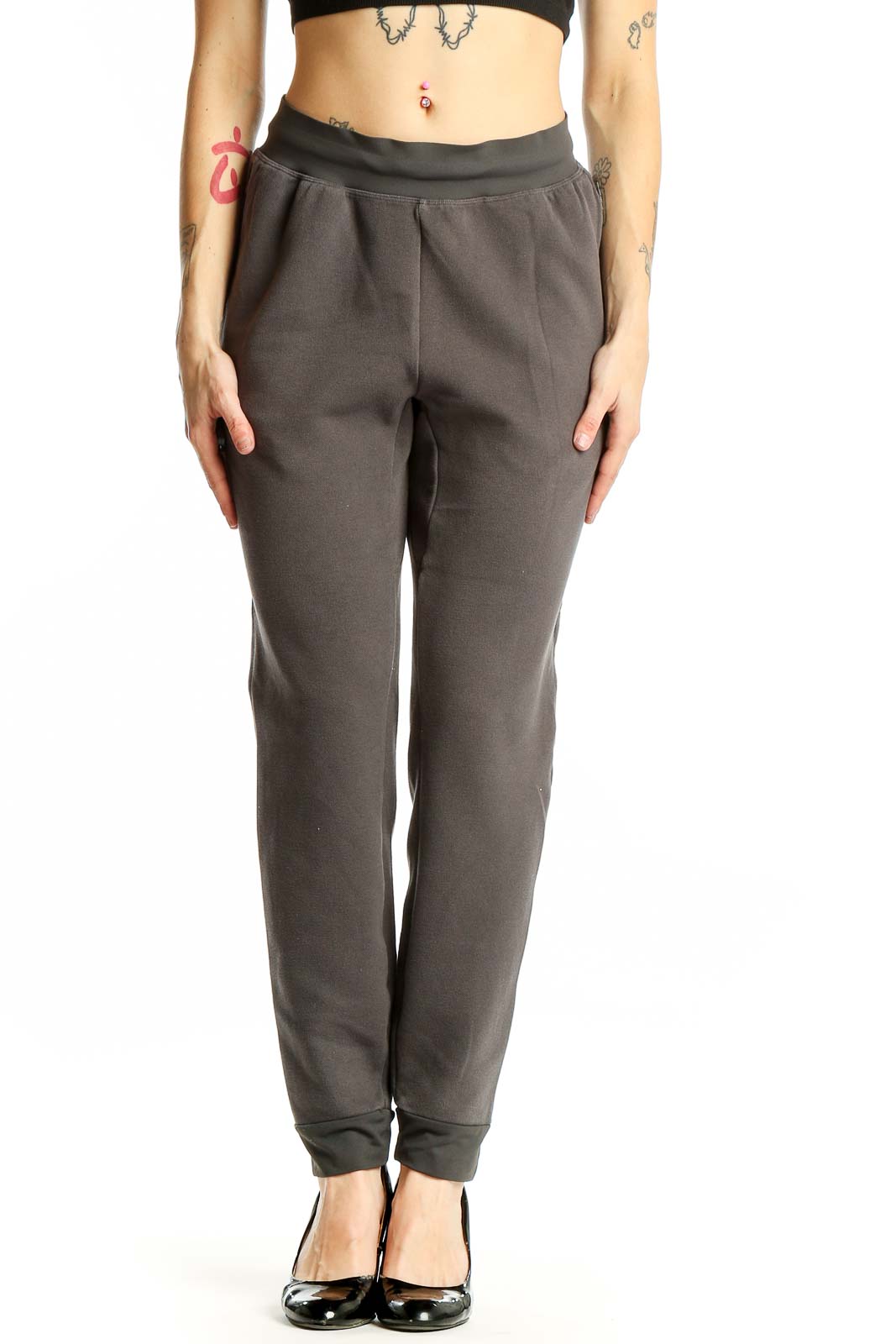 Front view of gray Gymshark jogger pants with tapered design