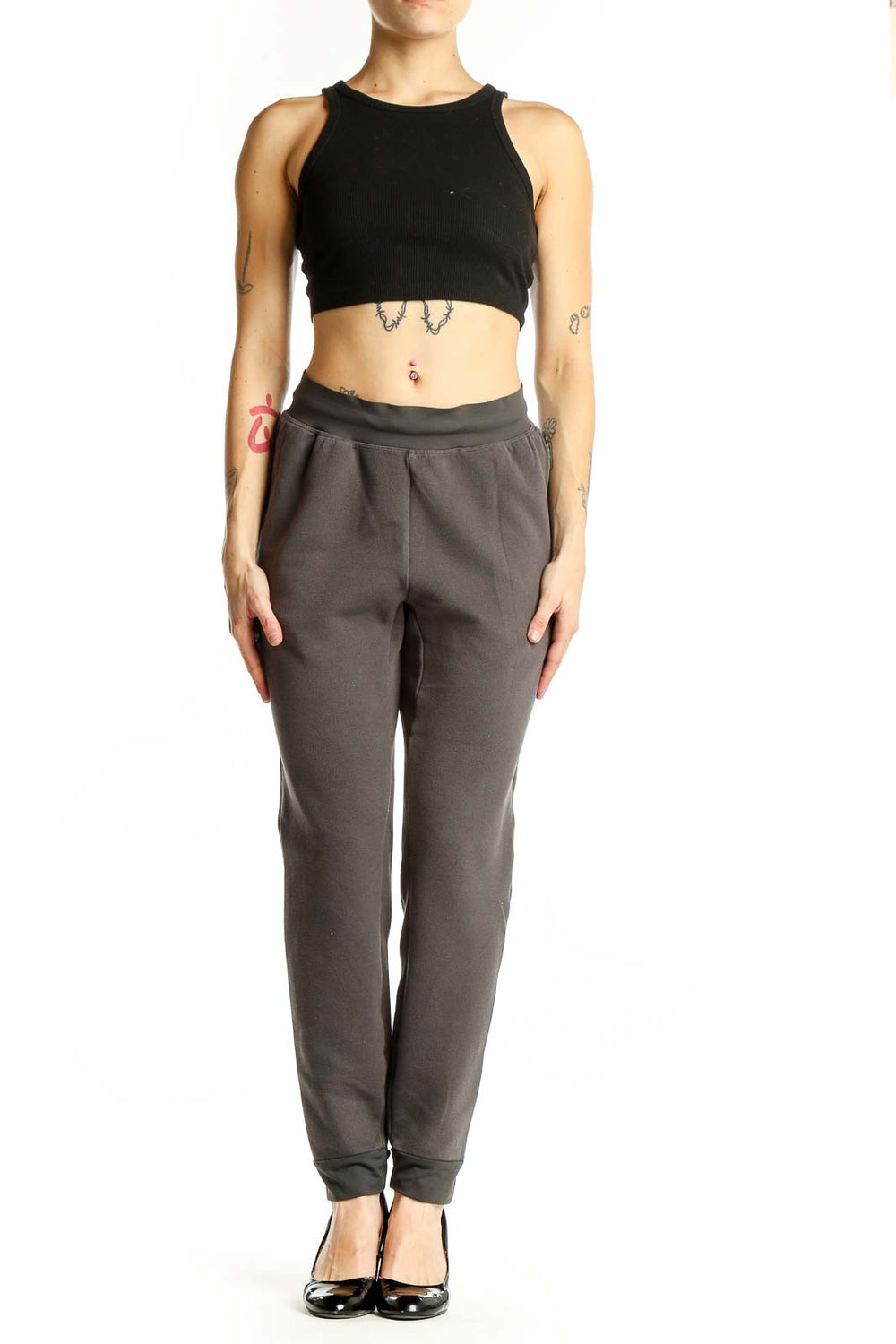 Front view of gray Gymshark jogger pants with tapered design